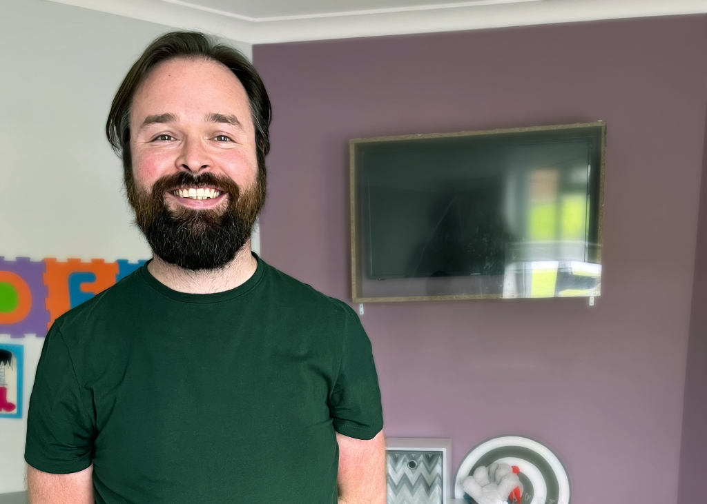 Senior Support Worker, Paul Moynihan standing in Claddagh House in Galway.